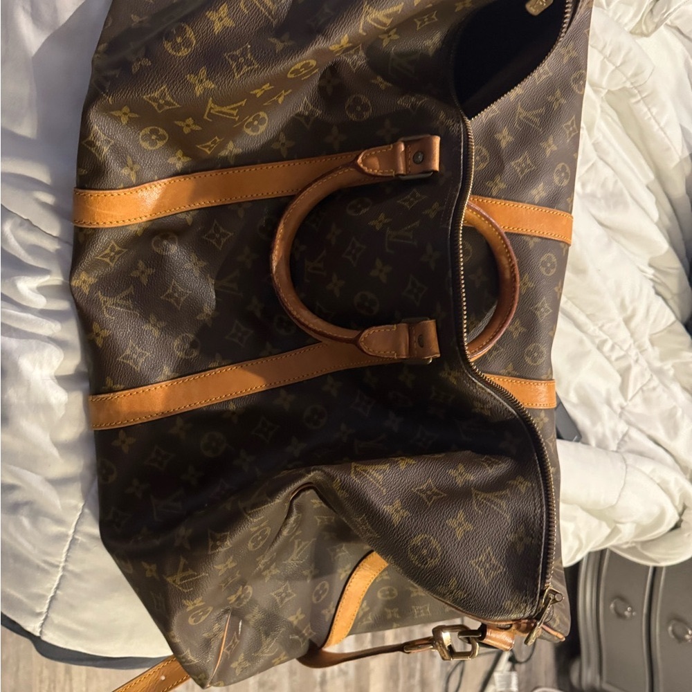 Louis Vuitton Brown Travel Bag with Monogram Pattern and Leather Trim